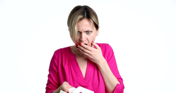 Sick woman coughing up blood and surprised on white background 4k movie. Symptoms of tuberculosis and lung cancer concept
