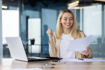 Successful businesswoman celebrating a triumph at work