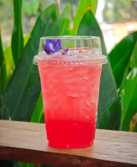 a cup of strawberry soda cool juice