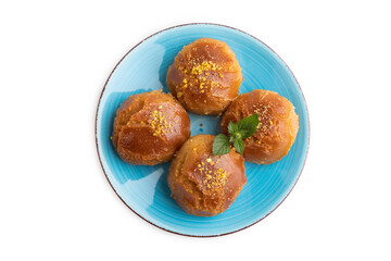Traditional turkish dessert sekerpare with almonds and honey isolated on white, top view.