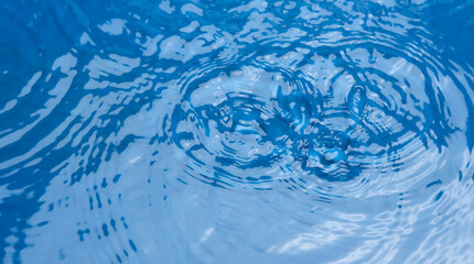Closeup​ blur​ abstract​ of​ surface​ blue​ water. Abstract​ of​ surface​ blue​...