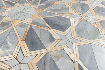 Floor tiling with Arabic geometric pattern. Stone mosaic background