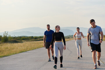 A group of friends maintains a healthy lifestyle by running outdoors on a sunny day, bonding over fitness and enjoying the energizing effects of exercise and nature - 774175841