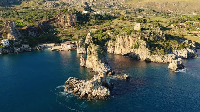 Aerial sunset view of Scopello Beach in Sicily, Italy. Tonnara di Scopello