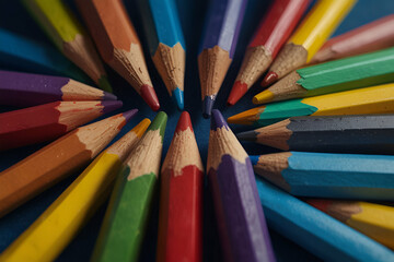 Fototapeta premium colored pencils with on blue background educational concept.generative.ai