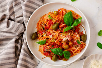 Pasta Putaneska, with  tomato sauce  and basil .top veiw.selective focus