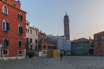 Campo San Anzolo square and the bell tower of the Stanto Stefano Church on a sunny winter evening,...