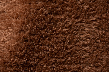 Texture of a brown faux fur as a background.
