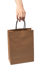 Paper bag in woman hand isolated on a white background.