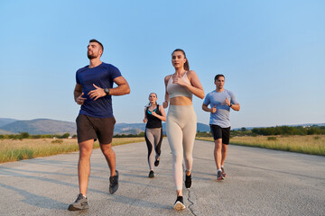 A group of friends maintains a healthy lifestyle by running outdoors on a sunny day, bonding over fitness and enjoying the energizing effects of exercise and nature - obrazy, fototapety, plakaty