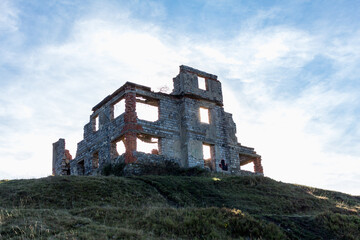 a ruined building in the mountains