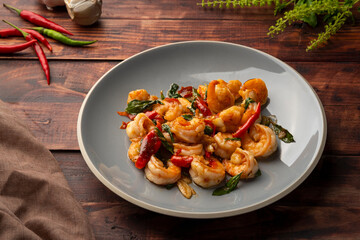 Stir fried shrimp with thai basil on grey plate,thai spicy food