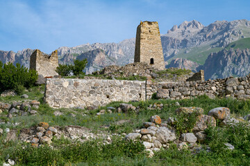 Sunny June day at the ruins of the ancient Ossetian village of Tsmiti. Verkhny Fiagdon. North Ossetia Alania. Russia - 774223421