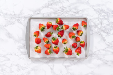 Washed Strawberries Drying on a Paper Towel-Lined Baking Sheet