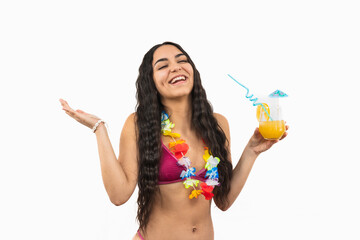 Happy young Latin girl in bikini laughing cheerfully while holding a cocktail on white background