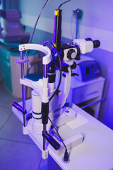 A modern microscope for vision testing in a light room. Microscope for vision correction.