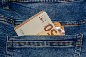 Fifty euro banknotes in blue jeans pocket