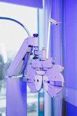 A modern microscope for vision testing in a light room. Microscope for vision correction.