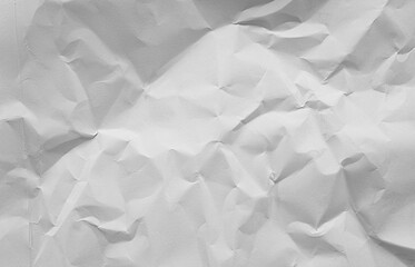 close up view of grey crumpled piece of construction paper use as background with blank space for design.