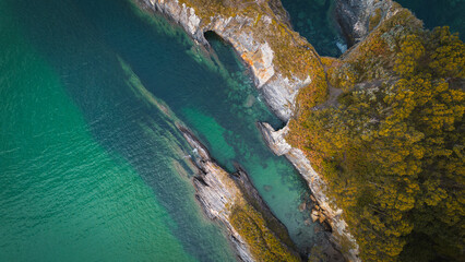 Aerial view of the coast with turquoise water and sharp cliffs in Galicia © Uri Prat