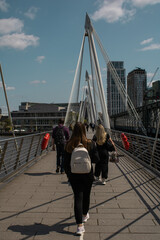 people walking on bridge