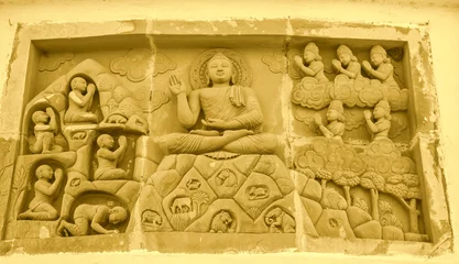 Papier Peint photo Dhaulagiri Stone wall carving at Buddha Pagoda Shanti Stupa, Dhaulagiri Orissa, India