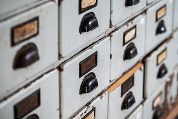 rows of files and boxes with numbers on them that are marked out