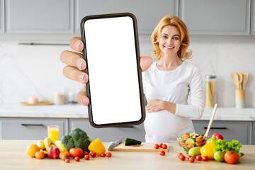 Pregnant lady offering view of smartphone