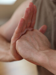 Hands of Yoga man doing Shield of Shambhala mudra close up. Inner Strength concept. Martial arts, Guardian Spirit concept