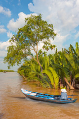 Fisherman is fishing in Mekong river in the morning - People boating in the delta of Mekong river,...