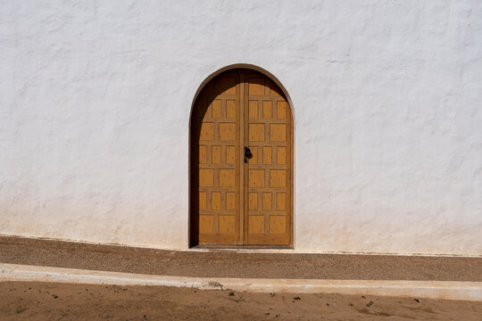 Doorway in the Side of a Whitewashed wall of a Mediterranean Church
