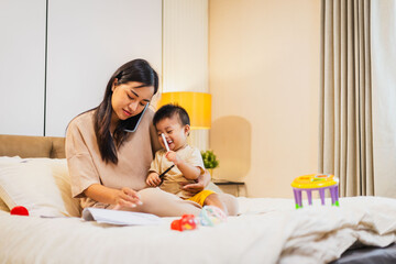 Women work while taking care of babies. It is a difficult job having to take on the roles of being an employee and a mother.