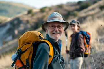 Grandfather and grandson teenage travel backpack hiking on the mountain, adventure.