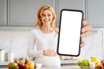 Pregnant woman showing smartphone screen