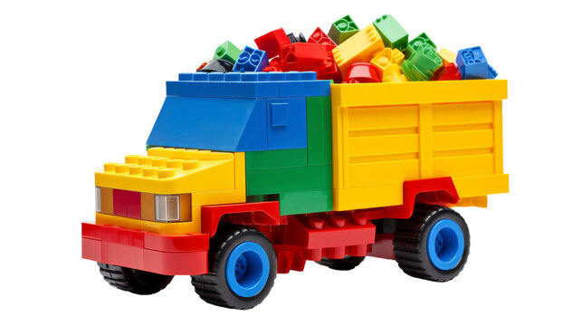 Toy truck filled with colorful Legos on a white background