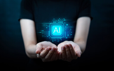 Business woman's hand holds AI icon. Business icon, technology innovation system. Concept of futuristic and global connectivity to enable access to information and online networks.