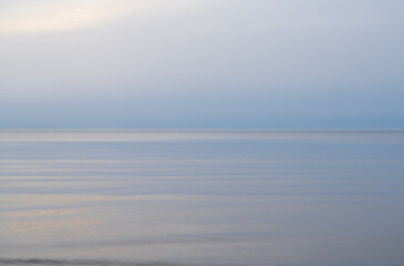 Loksa Estonia - March 31 2024: Mesmerizing dawn, where sea meets sky in perfect harmony, blending...