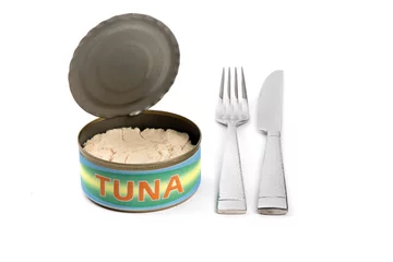Fotobehang An opened can with a generic, fake, label of tuna with a knife and fork suggesting an inexpensive seafood meal isolated on white © SockaGPhoto