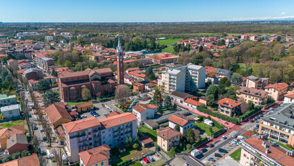 Limbiate aerial view, the parish of St. George, the church, homes and streets downtown. Monza and Brianza. 02-04-2024. Italy
