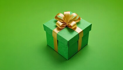 Obraz premium Gift box with golden ribbon on light green background, texture space