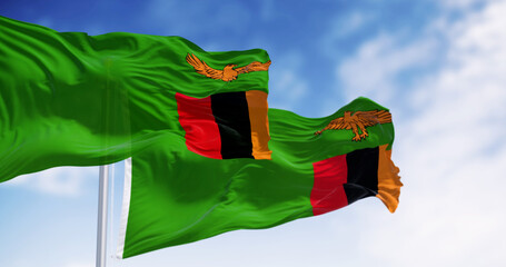 Zambia national flags waving on a clear day