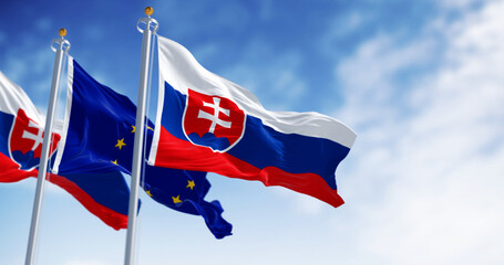 Close-up of Slovakia and the European Union flags waving on a clear day - 774285853