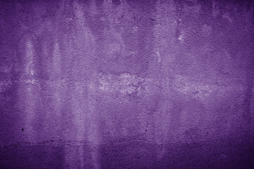 Closeup of grunge purple textured concrete background