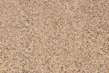Fine river sand from gravel pit pile closeup as beige sand natural background