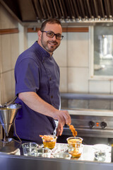 Preparing fresh organic shrimp cocktail with sauce