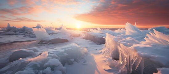 The sun setting over a serene lake creates beautiful ice formations along the shore, reflecting the warm hues of the sky - Powered by Adobe