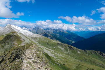 Panoramic view of majestic snow capped mountain peaks in Glockner group in High Tauern National...