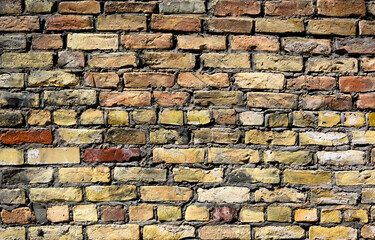 High resolution texture of a yellow brick wall background in the countryside 2
