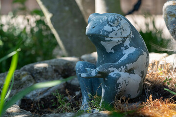 Frog statue in garden during spring.  