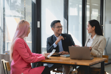 Business team in discussion at modern office. Corporate business meeting concept.